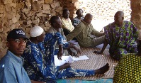 PCD's Mali Programme Manager and farmers 